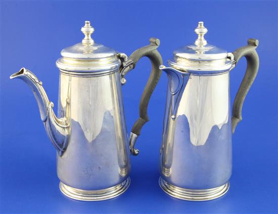 A George V silver cafe au lait pair, gross 29 oz.